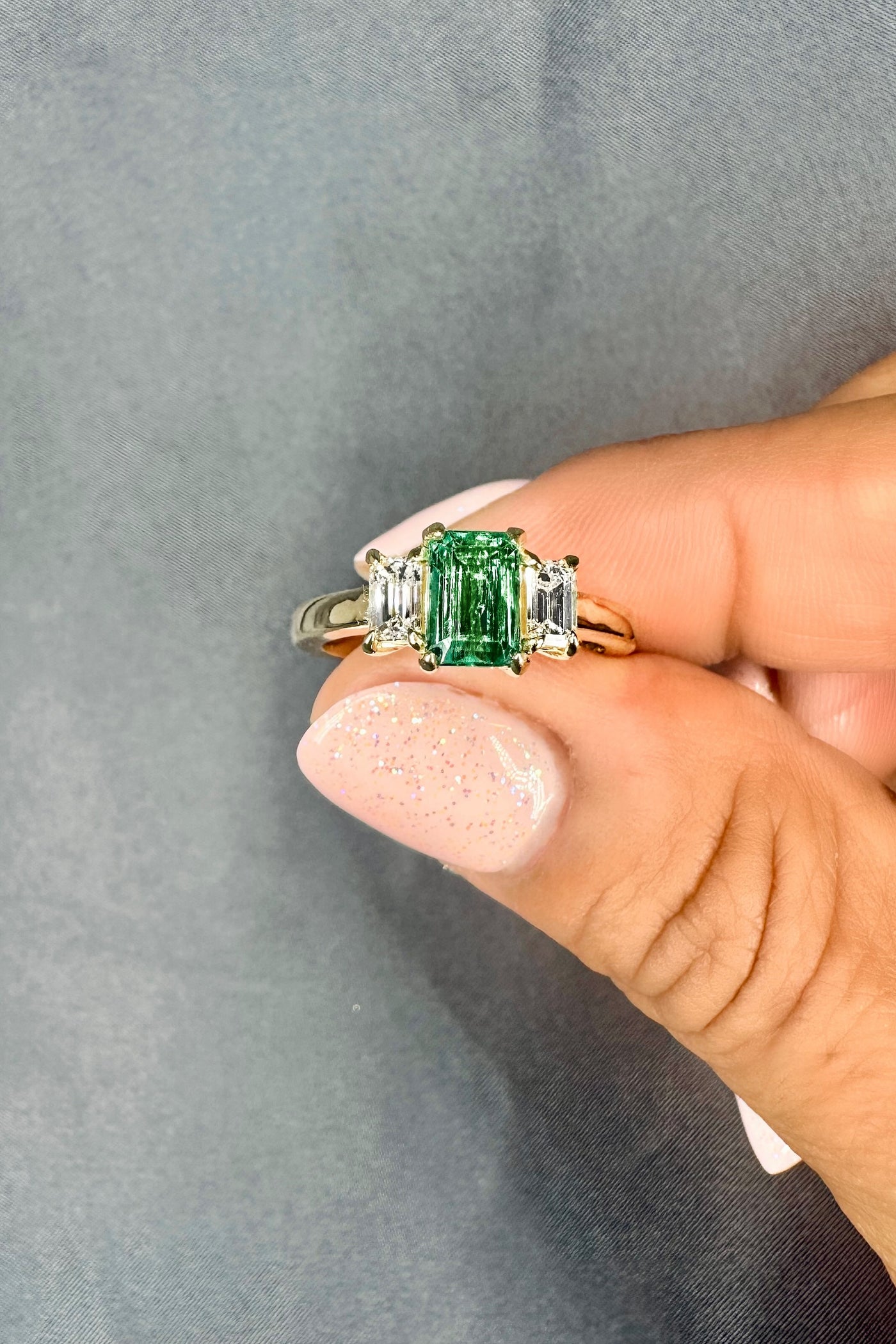 Three Stone 7x5MM Emerald Cut Natural Green Emerald & 0.50 Ct. Tw. Side Diamonds
