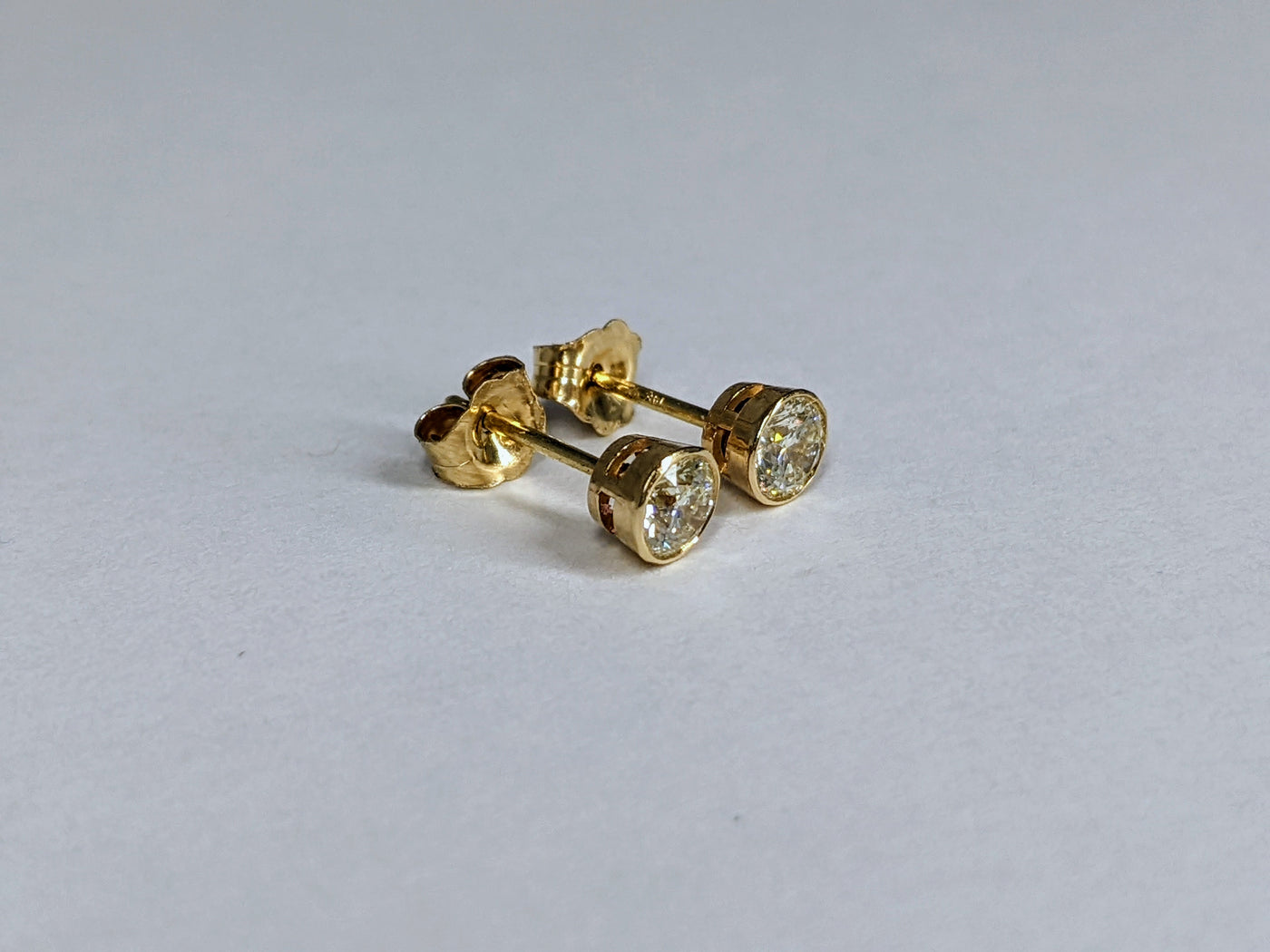 Bezel Set Round Cut Diamond Stud Earrings 0.50 ct. tw.