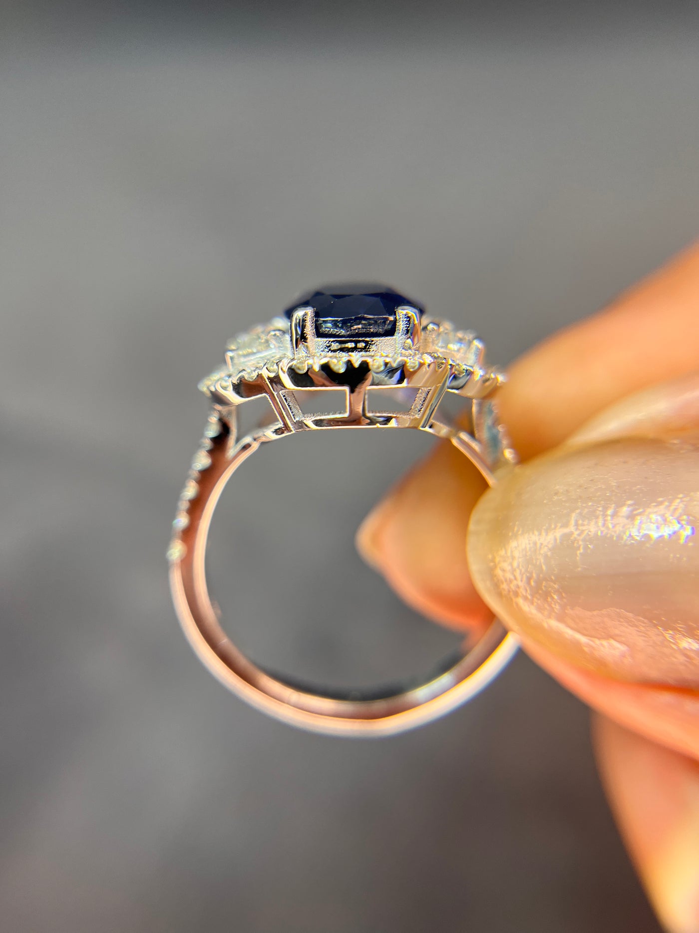 Halo Design 2 Ct. Tw. Oval Cut Natural Blue Sapphire with 1.25 Ct. Tw. Half Moon and Round Cut Side Diamond Ring